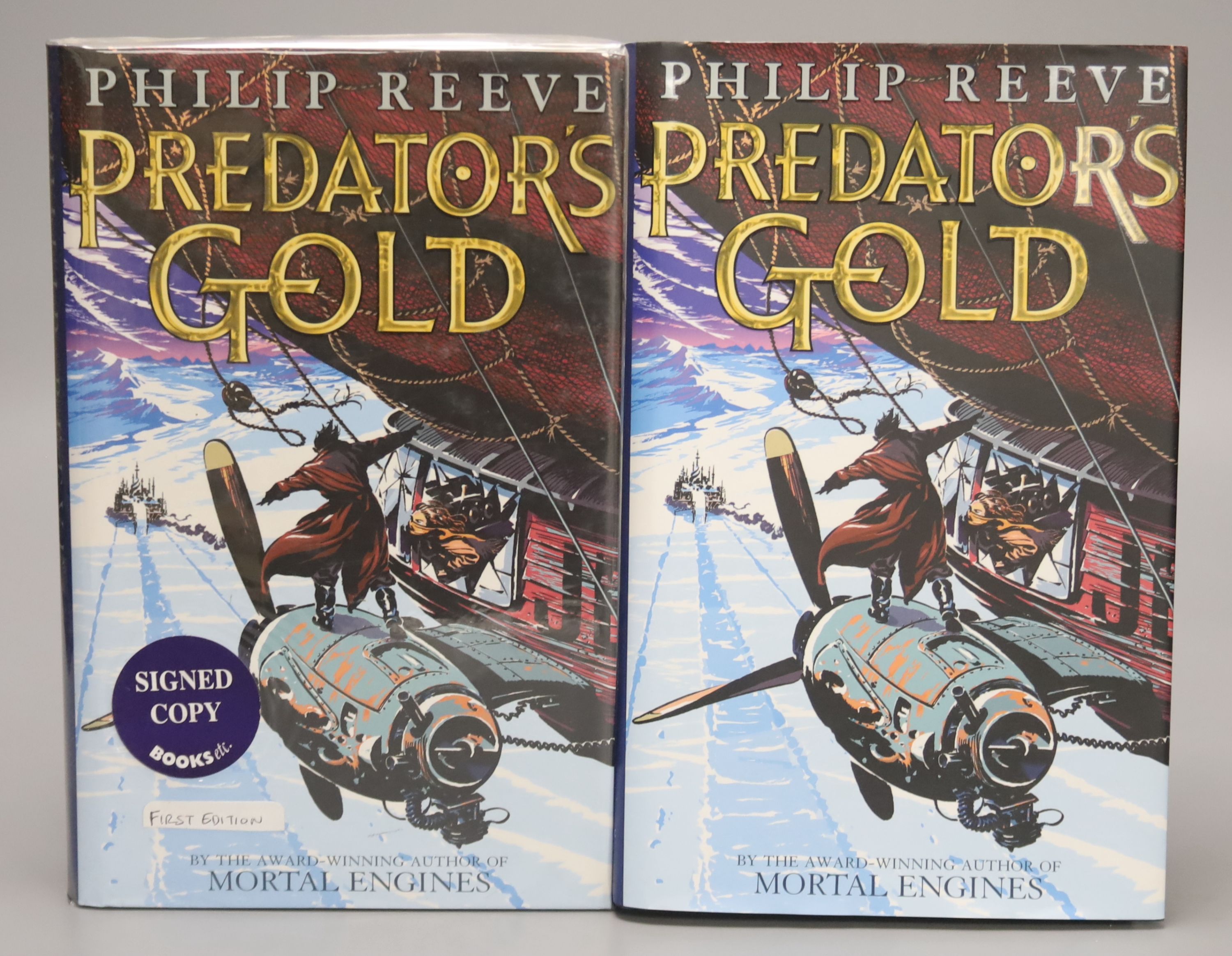 Reeve, Philip – Predator’s Gold, first edition, 8vo, hardback, signed (sealed in original film, stickered) Scholastic Press 2003, plus another unsigned copy (2)., Reeve, Philip – A Darkening Plan, first edition, 8vo, har